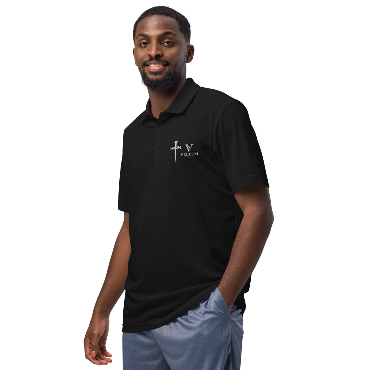 Vellum Adidas polo shirt featuring detailed embroidery on soft fabric, showcasing classic style and craftsmanship.